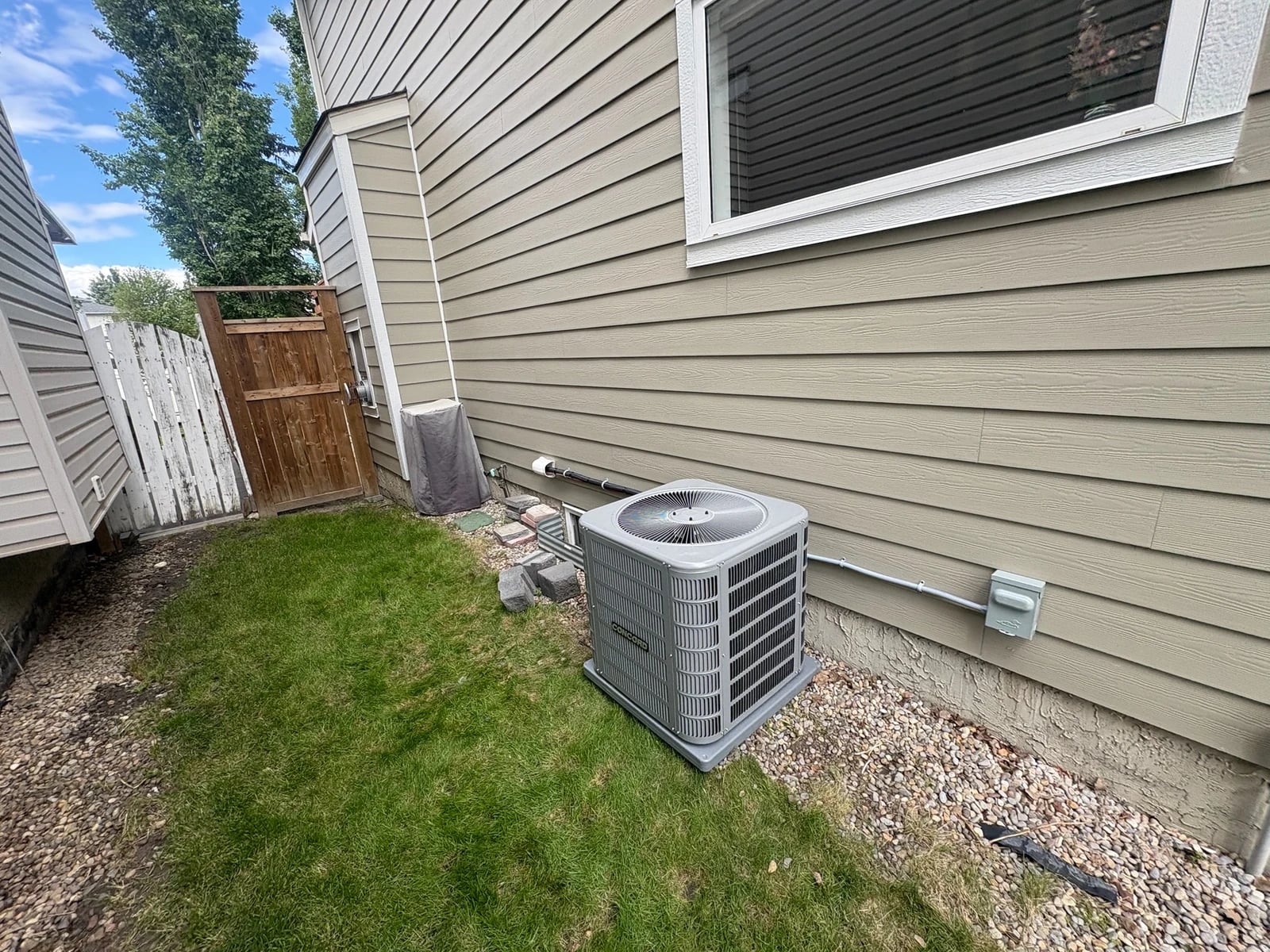 AC repair Calgary: a Concord air conditioner condenser beside a Calgary home