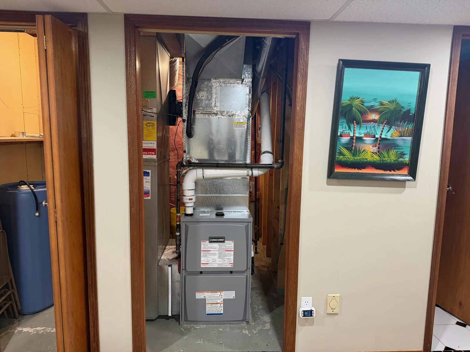 Furnace replacement and furnace installation Calgary: a new high-efficiency furnace installed by TNT in a Calgary furnace closet